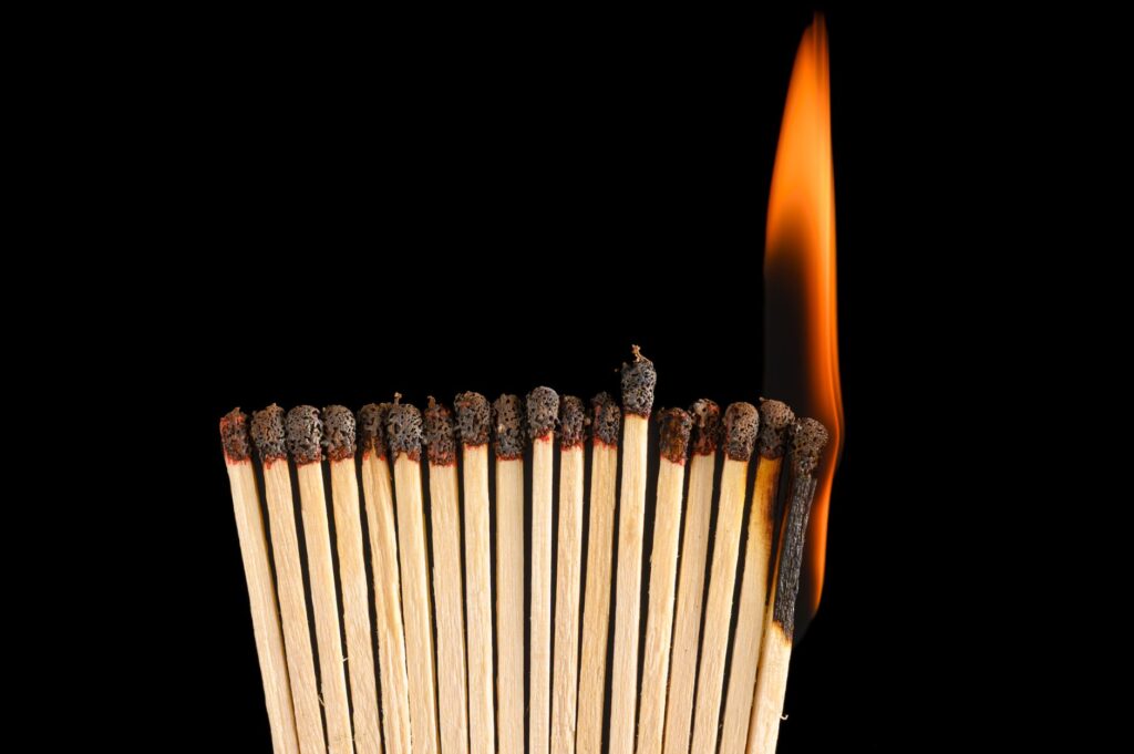 burning matchstick chain reaction concept